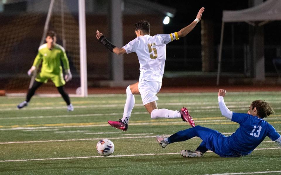 Enochs’ Christian Khanishian breaks free and set up a goal by teammate Fabian Ruiz during the Central California Athletic League game with Turlock at Turlock High School in Turlock, Calif., Wednesday, Jan. 24, 2024. Turlock won the game 2-1.
