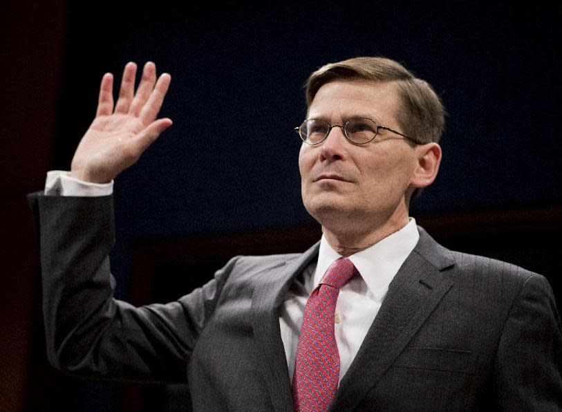 Former CIA Deputy Director Michael Morrell is sworn-in on Capitol Hill in Washington, Wednesday, April 2, 2014, prior to testifying before the House Intelligence Committee. Morrell, who edited the widely debunked talking points on the 2012 Benghazi attack, answered questions from the House intelligence committee in a rare open session. The hearing provides Morrell with a chance to explain why he deleted references to al-Qaida. (AP Photo/Manuel Balce Ceneta)