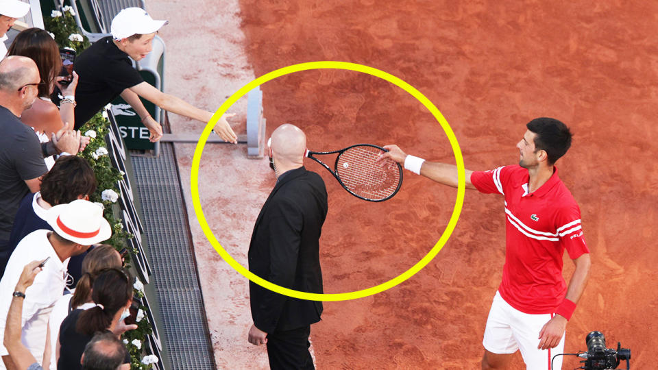 Novak Djokovic (pictured right) hands his racquet over to a fan in the stand after his Roland Garros victory.