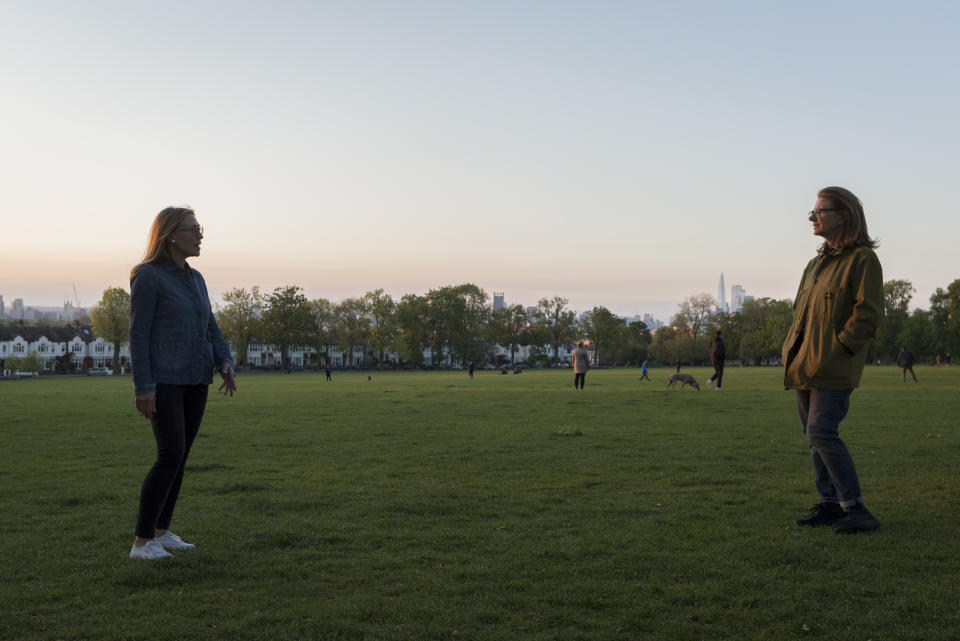 At the beginning of another week of Coronavirus pandemic lockdown, when the government is considering its options for a gradual opening of business with social distancing, during their daily exercise in Ruskin Park in south London, two women friends hold a conversation while observing social distancing of the two metres recommended by the government, on 4th May 2020, in Lambeth, London, England. (Photo by Richard Baker / In Pictures via Getty Images)