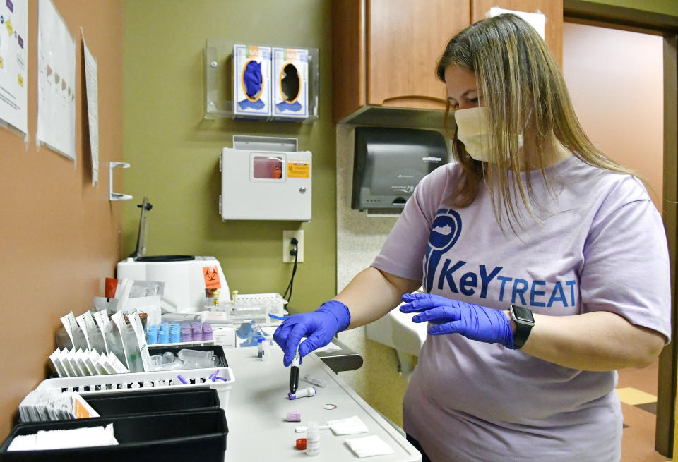 Ashley Holliday, senior medical assistant, prepares tests for hepatitis C and HIV in Hazard, Ky., Monday, Dec. 12, 2022. A study underway in the hard-hit corner of the state is exploring a simple way to get more people treated for hepatitis C. (AP Photo/Timothy D. Easley)