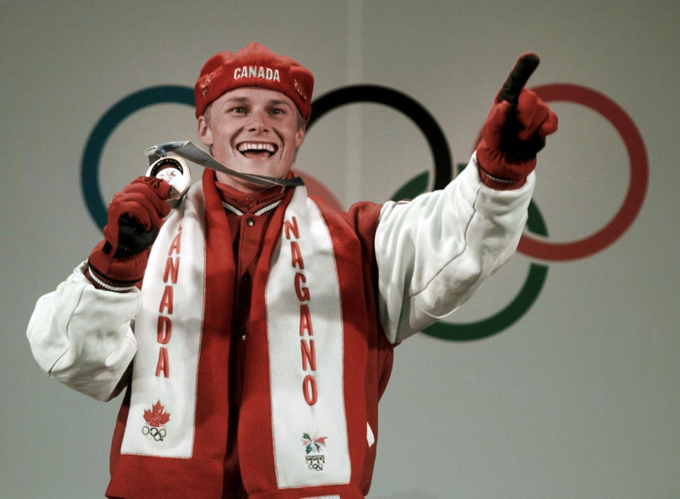 Ross Rebagliati holds his gold medal in the Snowboard Men’s Giant Slalom at the victory ceremony for the Winter Olympics in Nagano, Japan, Sunday, Feb. 8, 1998. (AP Photo/Alexander Zemlianichenko)