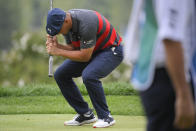 Bryson DeChambeau reacts after missing his putt on the ninth green during the final round of the BMW Championship golf tournament, Sunday, Aug. 29, 2021, at Caves Valley Golf Club in Owings Mills, Md. (AP Photo/Nick Wass)