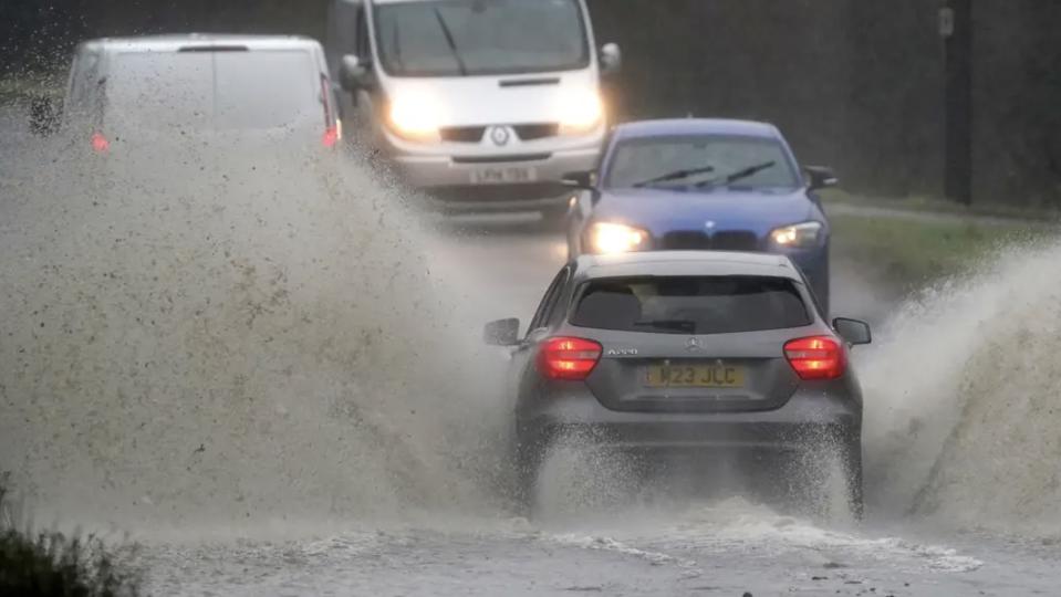 Motorists were forced to make their way through flooded roads after Storm Henk lashed the UK. (PA)