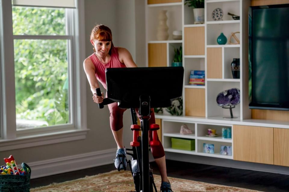 Bowflex Woman Riding Bike