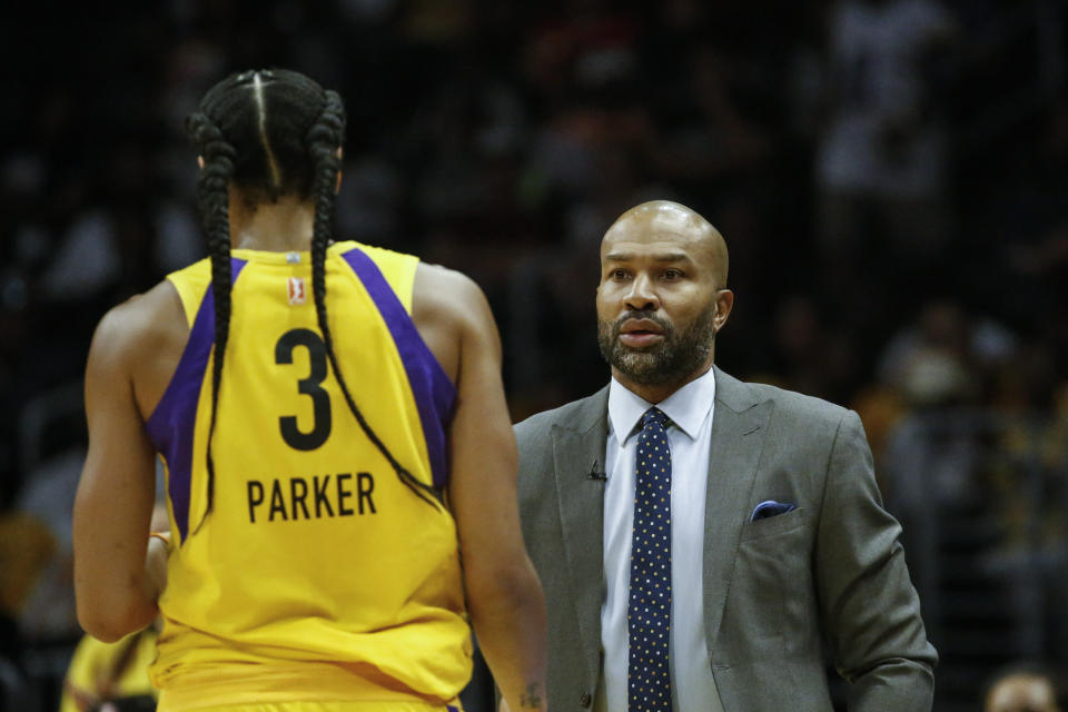 Los Angeles Sparks' head coach Derek Fisher talks to Los Angeles Sparks' Candace Parker (3) during a WNBA basketball game between Los Angeles Sparks and Minnesota Lynx in Los Angeles, Sunday, Sept. 8, 2019. The Sparks won 77-68. (AP Photo/Ringo H.W. Chiu)