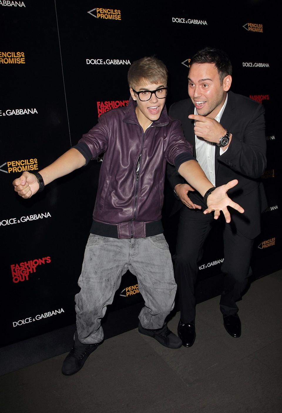 Justin Bieber and Scooter Braun attend the Fashion Night Out Dolce & Gabbana on Sept. 8, 2011, in New York. Braun discovered Bieber as a 12-year-old uploading singing videos to YouTube.