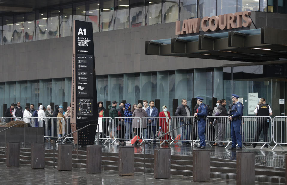 Family and survivors from the March 2019 Christchurch mosque shootings arrive outside the Christchurch High Court for the sentencing of twenty-nine-year-old Australian Brenton Harrison Tarrant, in Christchurch, New Zealand, Monday, Aug. 24, 2020. Tarrant has pleaded guilty to 51 counts of murder, 40 counts of attempted murder and one count of terrorism in the worst atrocity in the nation's modern history. (AP Photo/Mark Baker)