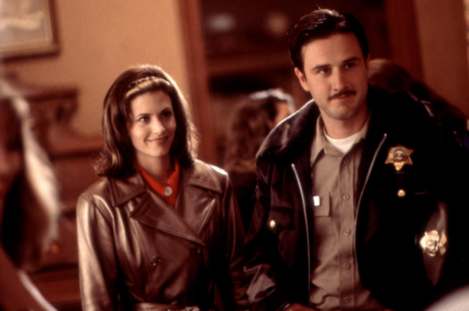 Courteney and David stand side by side in the movie