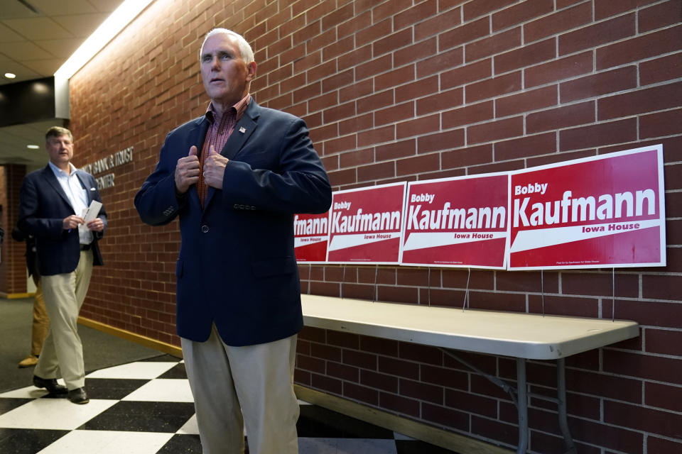 Former Vice President Mike Pence waits to speak to reporters at the Kaufmann Family Harvest Dinner, Thursday, Sept. 29, 2022, in Wilton, Iowa. (AP Photo/Charlie Neibergall)