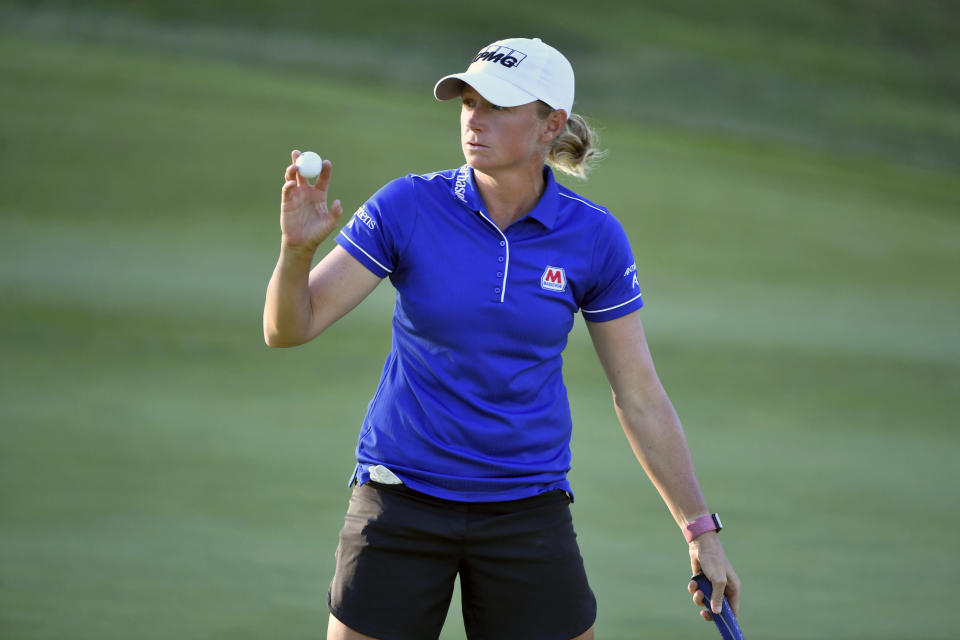 Stacy Lewis waves to fans after sinking her putt on the 9th green during the second round of the LPGA Walmart NW Arkansas Championship golf tournament, Saturday, Sept. 25, 2021, in Rogers, Ark. (AP Photo/Michael Woods)