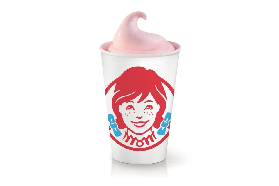 a white cup with Wendy's logo and a swirl of pink frosty at top