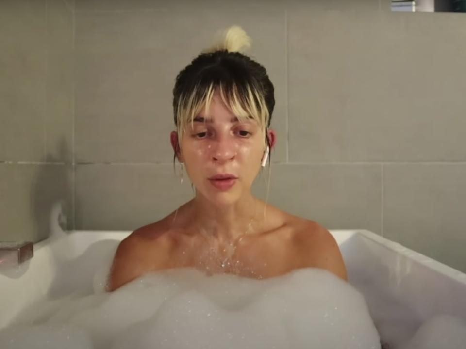 A picture of Gabbie Hanna in a bathtub.