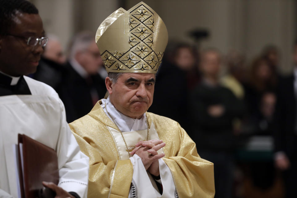 FILE - Mons. Giovanni Angelo Becciu presides over an eucharistic liturgy, at the St. John in Latheran Basilica, in Rome, Thursday, Feb. 9, 2017. The Vatican's chief prosecutor has appealed a court verdict that, while finding a cardinal guilty of embezzlement, largely dismantled his theory of a grand conspiracy to defraud the Holy See of millions of euros.(AP Photo/Gregorio Borgia, File )