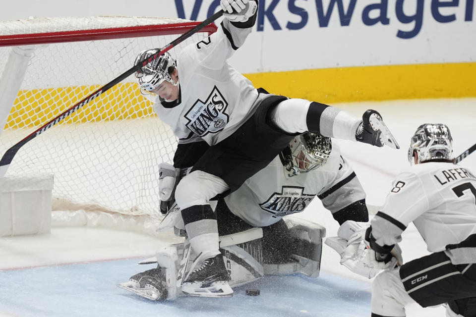 Los Angeles Kings defenseman Jordan Spence comes off his feet as Los goaltender David Rittich defends the goal during the third period an NHL hockey game against the Dallas Stars in Dallas, Saturday, March 16, 2024. (AP Photo/LM Otero)