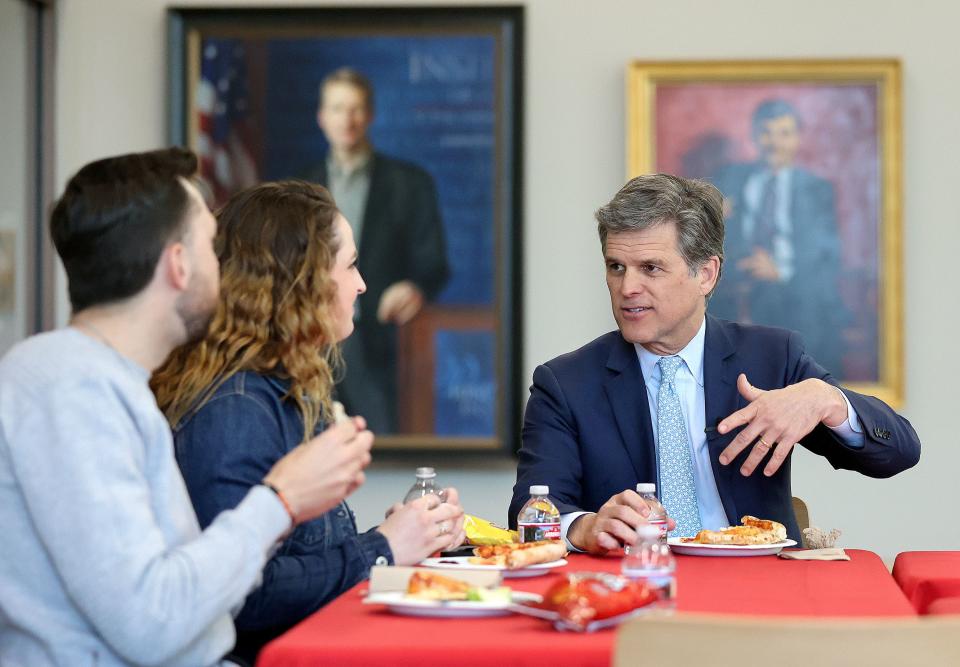 University of Utah impact scholar Tim Shriver, right, meets with members of Students for Dignity, including Preston Brightwell, left, and Maddie Hair at the University of Utah in Salt Lake City on Wednesday, April 19, 2023. | Kristin Murphy, Deseret News