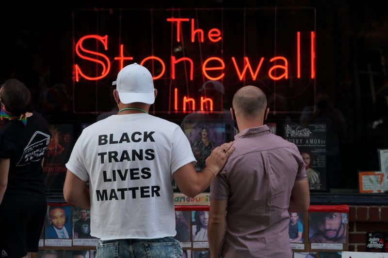 People gather at the Stonewall Inn for a rally in support of the Supreme Court decision to uphold LBGTQ+ workplace rights in New York