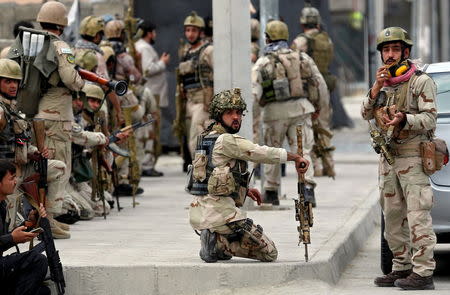 Members of Afghan security forces arrive at the site of an attack near the Afghan parliament in Kabul, Afghanistan June 22, 2015. REUTERS/Ahmad Masood