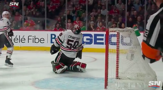 Chicago Blackhawks goaltender Corey Crawford takes a shot from Montreal Canadiens defenseman Shea Weber. 