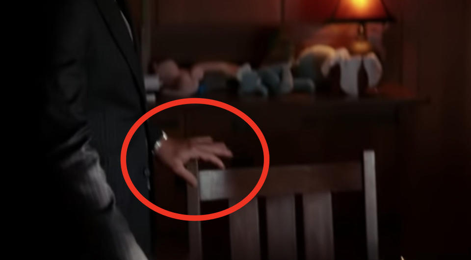 A shot of Cobb's hand, showing no wedding ring