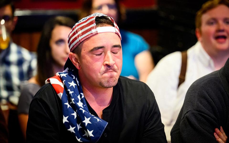 A patron reacts during a watch party for the first presidential debate of the 2024 presidential elections between President Joe Biden and former President and Republican presidential candidate Donald Trump at a pub in San Francisco, California, on June 27, 2024. The presidential debate is taking place in Atlanta, Georgia.