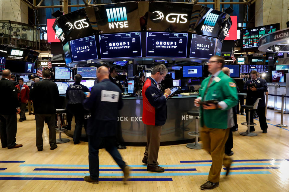 Traders work on the floor of the New York Stock Exchange (NYSE) in New York, U.S., October 3, 2017. REUTERS/Brendan McDermid