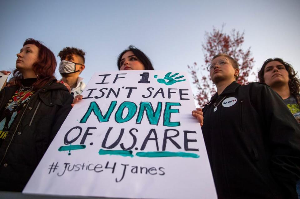 <div class="inline-image__caption"><p>Supporters of the Jane Doe's, student-organization Justice For Janes and alumni-organization Save71 hold up a sign during a rally to call for a third-party audit of the mishandling of sexual assault cases on Liberty University's campus in Lynchburg, Va. on Thursday, Nov. 4, 2021.</p></div> <div class="inline-image__credit">Kendall Warner/The News & Advance via AP</div>