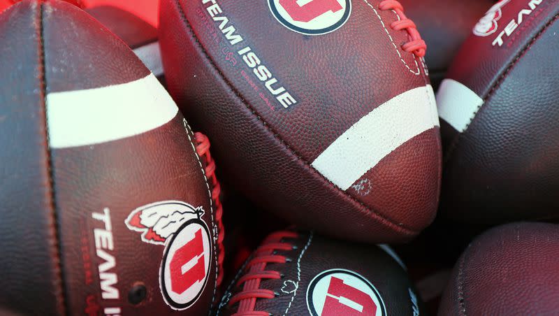 Practice footballs sit in a cart as the Utes and the Trojans prepare to play at Rice Eccles Stadium in Salt Lake City on Saturday, Oct. 15, 2022.