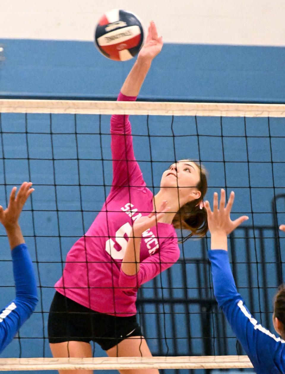 Ella McCabe of Sandwich spikes the ball at St. John Paul II uring an Oct. 24, 2022 match.