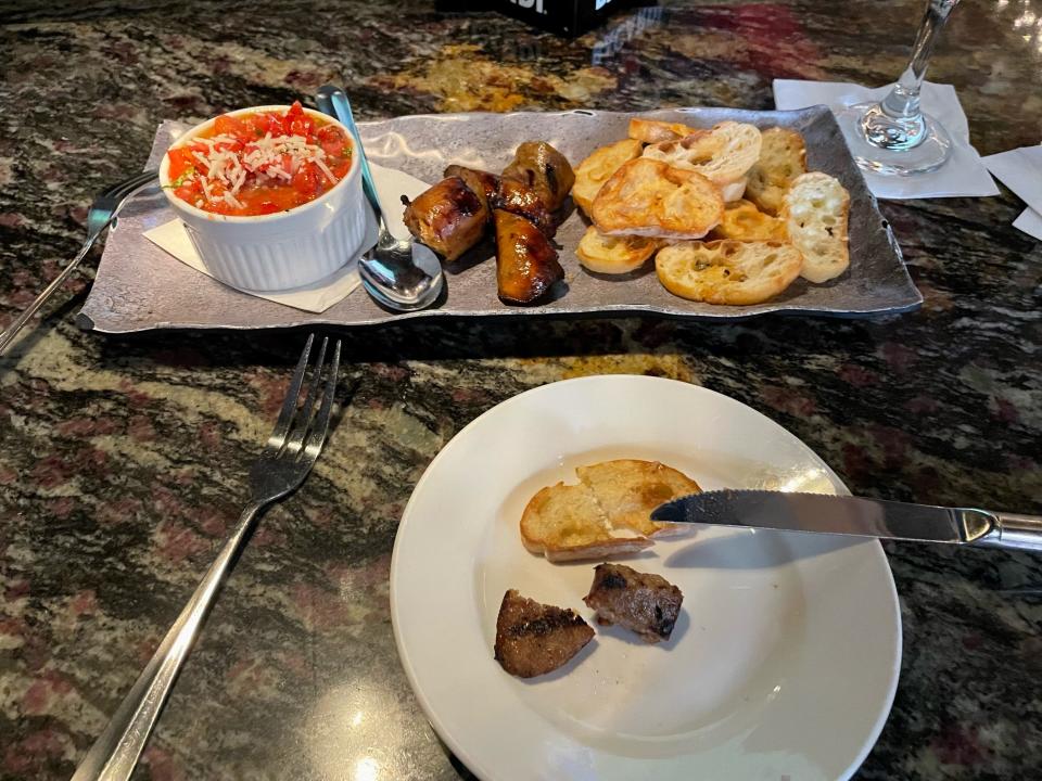 A 54-year-old Fayetteville pharmacist eats Italian sausage at Luigi's Italian Chophouse and Bar, 528 N. McPherson Church Road.