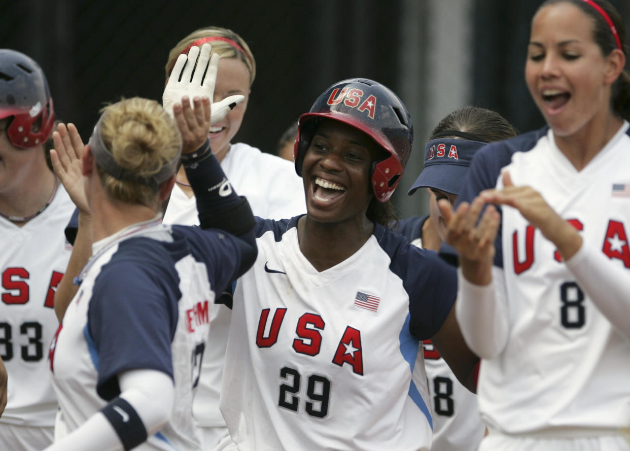 Natasha Watley celebrates with Team USA after hitting a two-run home run during the 2008 Beijing Olympic Games. (REUTERS/Jessica Rinaldi)
