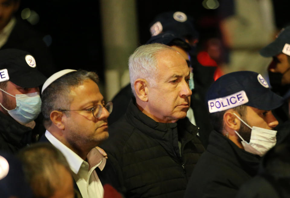 A Jan. 27, 2023 file photo shows Israeli Prime Minister Benjamin Netanyahu (R) and Israeli National Security Minister Itamar Ben-Gvir (L) at the scene of an attack in a Jewish settlement in East Jerusalem that left seven people dead. / Credit: Mostafa Alkharouf/Anadolu Agency/Getty