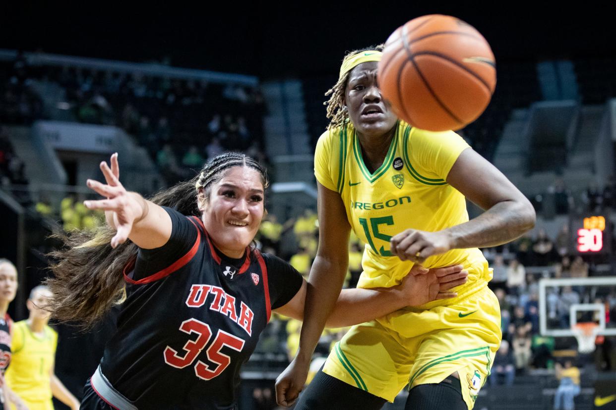 Utah forward Alissa Pili and Oregon center Phillipina Kyei go after a loose ball as the Oregon Ducks host the No. 16 Utah Utes Friday, Jan. 26, 2024 at Matthew Knight Arena in Eugene, Ore.