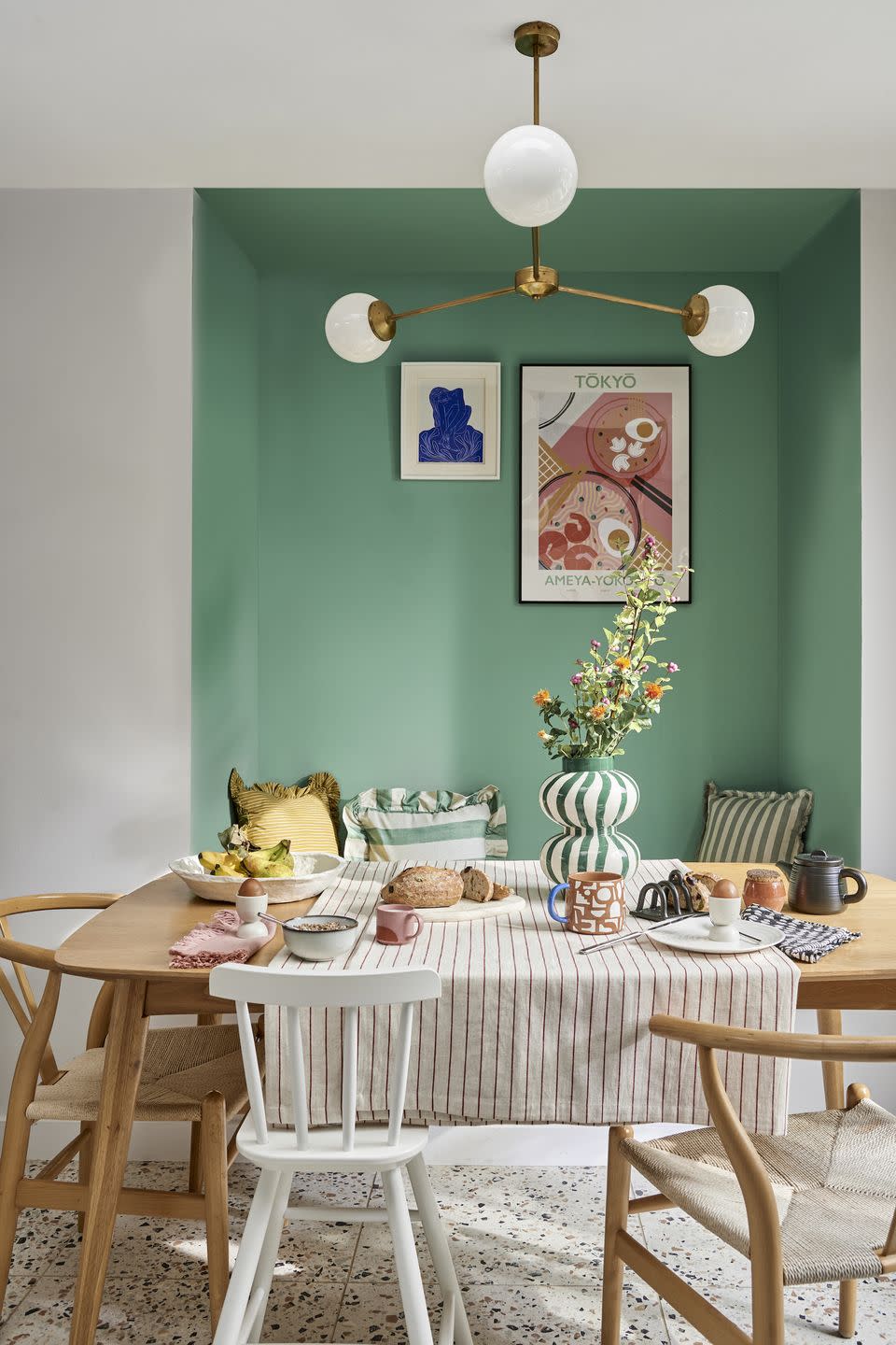 a dining table with a chandelier above it