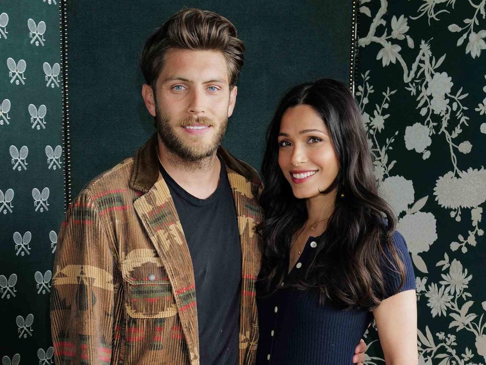 <p>Darren Gerrish/WireImage</p> Cory Tran and Frieda Pinto wearing Ralph Lauren, attend the Ralph Lauren Suite during The Championships, Wimbledon