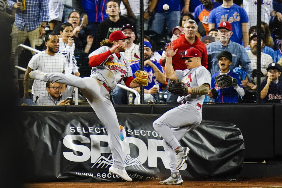 St. Louis Cardinals' Brendan Donovan, left, and Tyler O'Neill, right, run into each other while trying to catch a foul ball hit by New York Mets' Francisco Lindor during the eighth inning in the second baseball game of a doubleheader Tuesday, May 17, 2022, in New York. (AP Photo/Frank Franklin II)