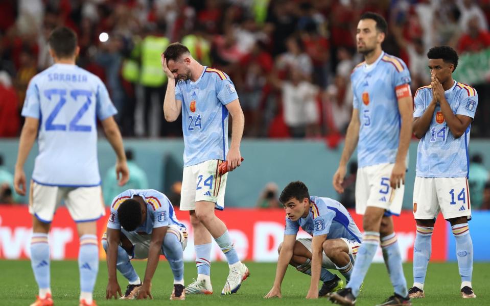 Dejected players of Spain react after losing the penalty shoot out and are eliminated - GETTY IMAGES