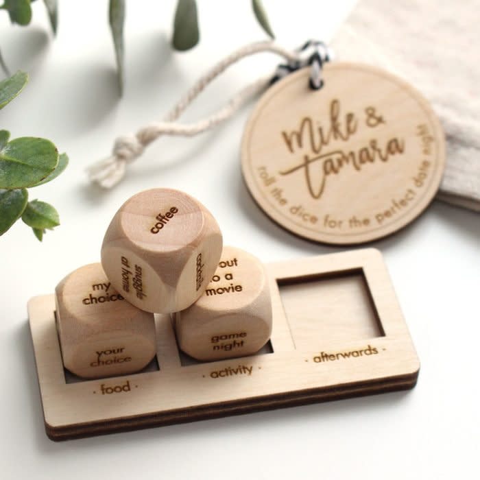 <a href="https://www.etsy.com/listing/660168036/personalized-date-night-dice-5th?" rel="nofollow noopener" target="_blank" data-ylk="slk:SugarBlushStudio Personalized Date Night Dice;elm:context_link;itc:0;sec:content-canvas" class="link rapid-noclick-resp">SugarBlushStudio Personalized Date Night Dice</a>