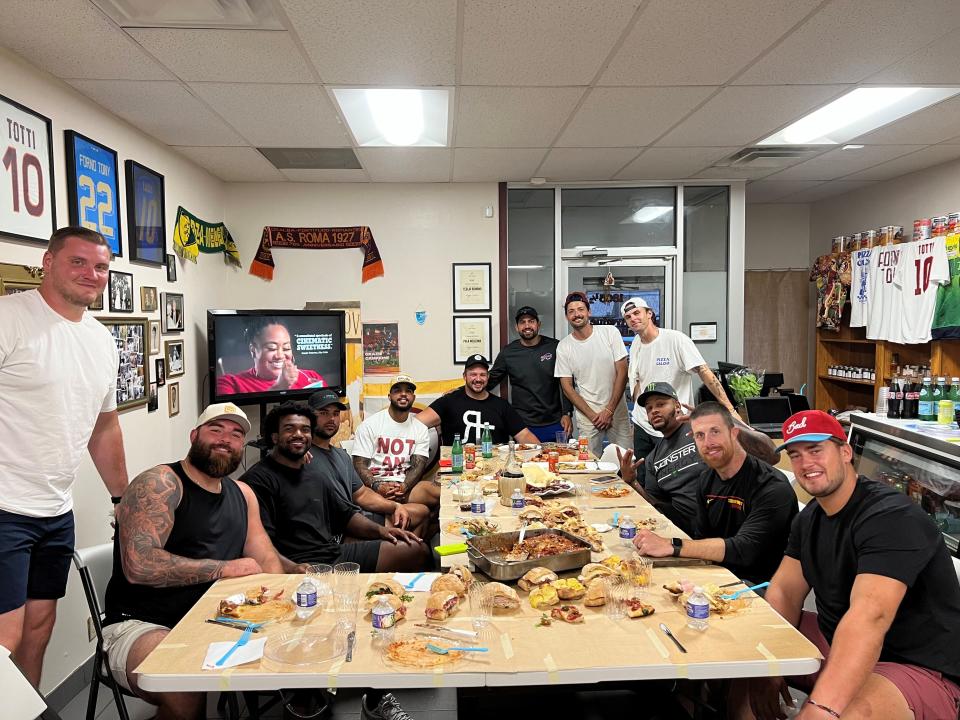 Forno Tony hosted a group of Buffalo Bills players in 2023. Billy Gushue, co-owner and chef, is in the back, in the white T-shirt and maroon hat.