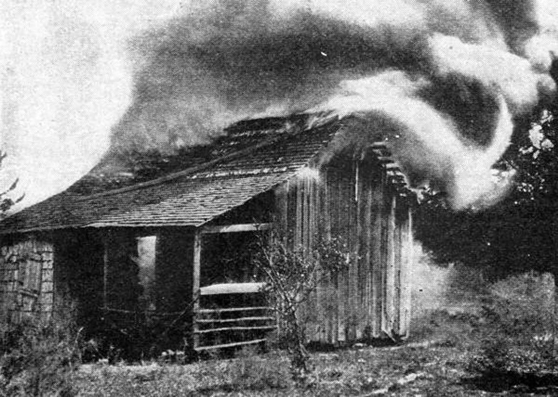 The home of African-American residents burns during the 1923 race riot in Rosewood.