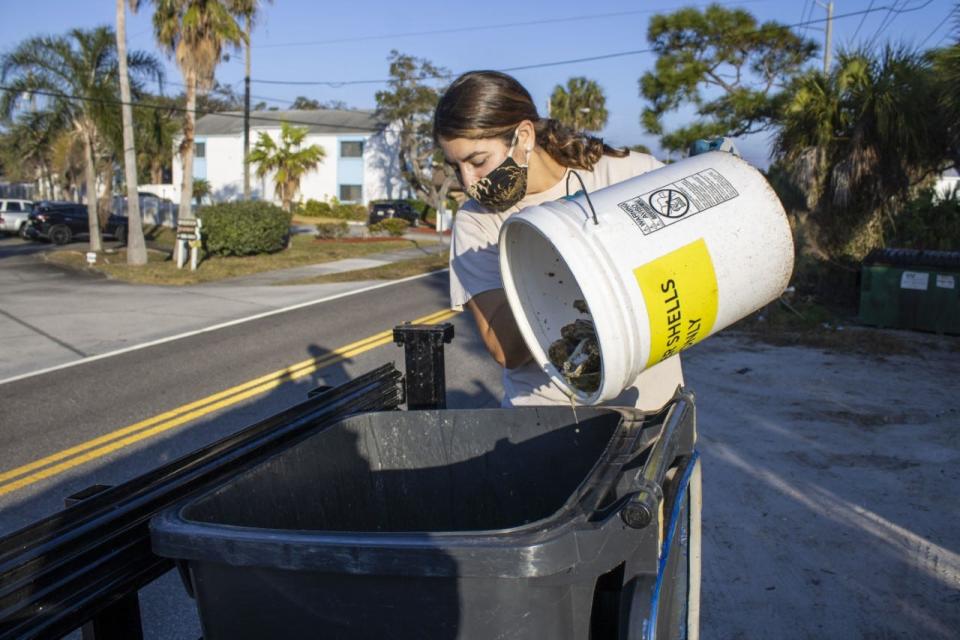 Brevard Zoo Conservation Manager Olivia Escandell places oyster shells into a container for use in the zoo's oyster shell recycling program. Since 2014, the Brevard Zoo has recycled 5.6 million pounds of shell from local restaurants, an oyster shucking house, and various other vendors and festivals. This recycled shell has been used to support various oyster restoration projects in the Indian River Lagoon.