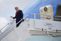 President Donald Trump exits Air Force One at Miami International Airport on Friday, July 10, 2020. (AP Photo/Evan Vucci)