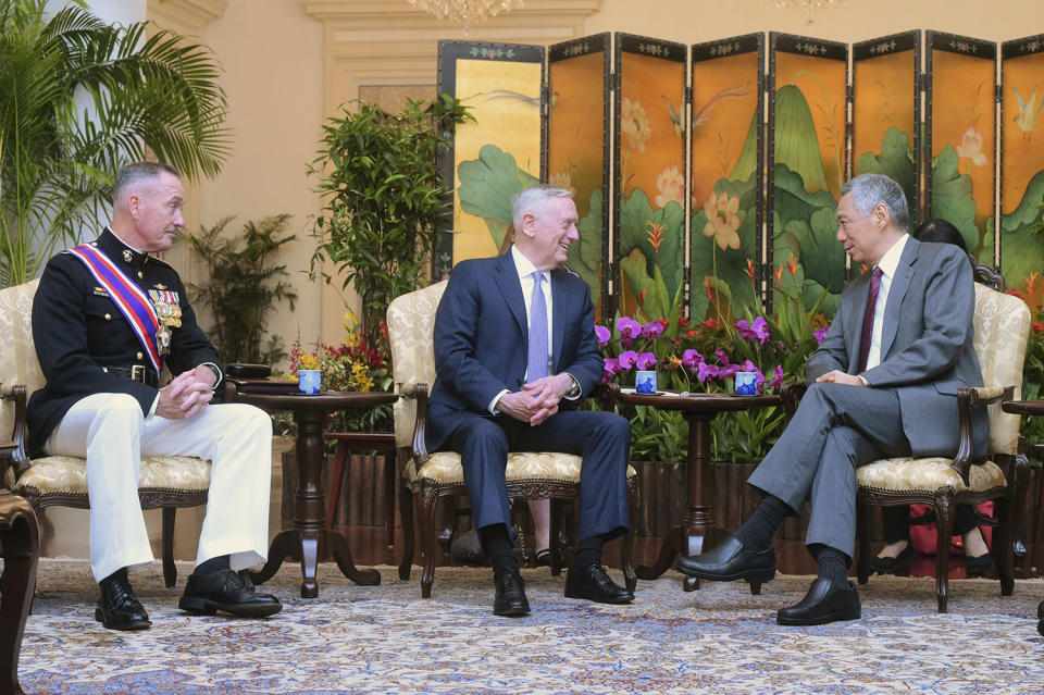 Singapore's Prime Minister Lee Hsien Loong, right, meets U.S. Defense Secretary Jim Mattis, center, and Joint Chiefs Chairman Gen. Joseph Dunford Jr.