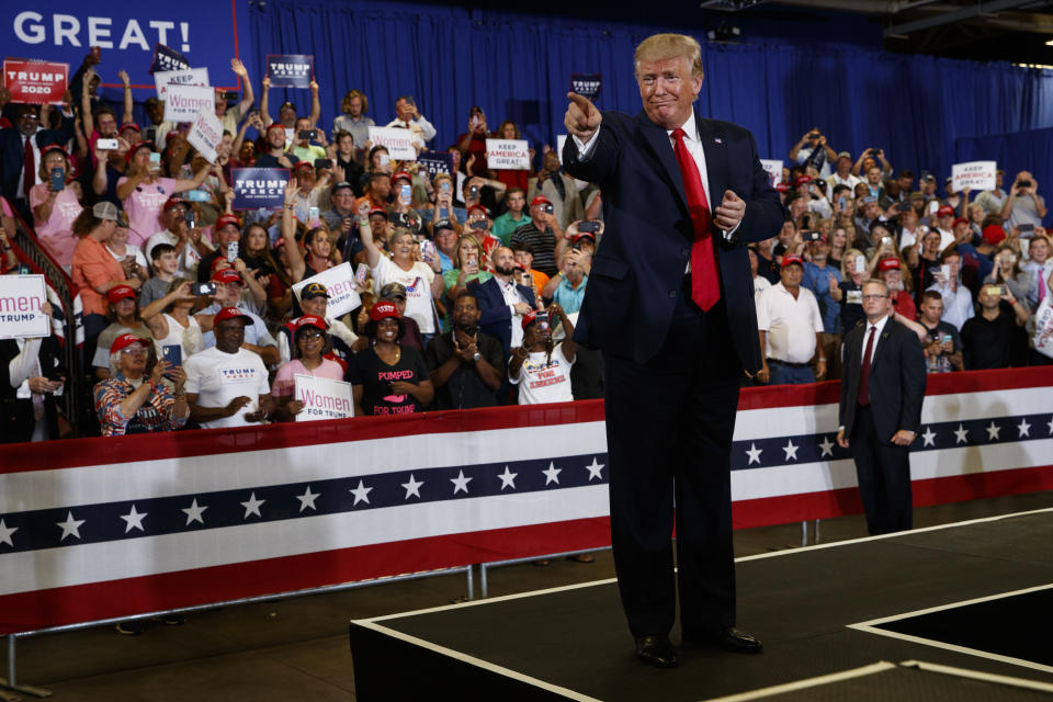 President Donald Trump arrives on stage at the Crown Expo for a campaign rally, Monday, Sept. 9, 2019, in Fayetteville, N.C. (AP Photo/Evan Vucci)