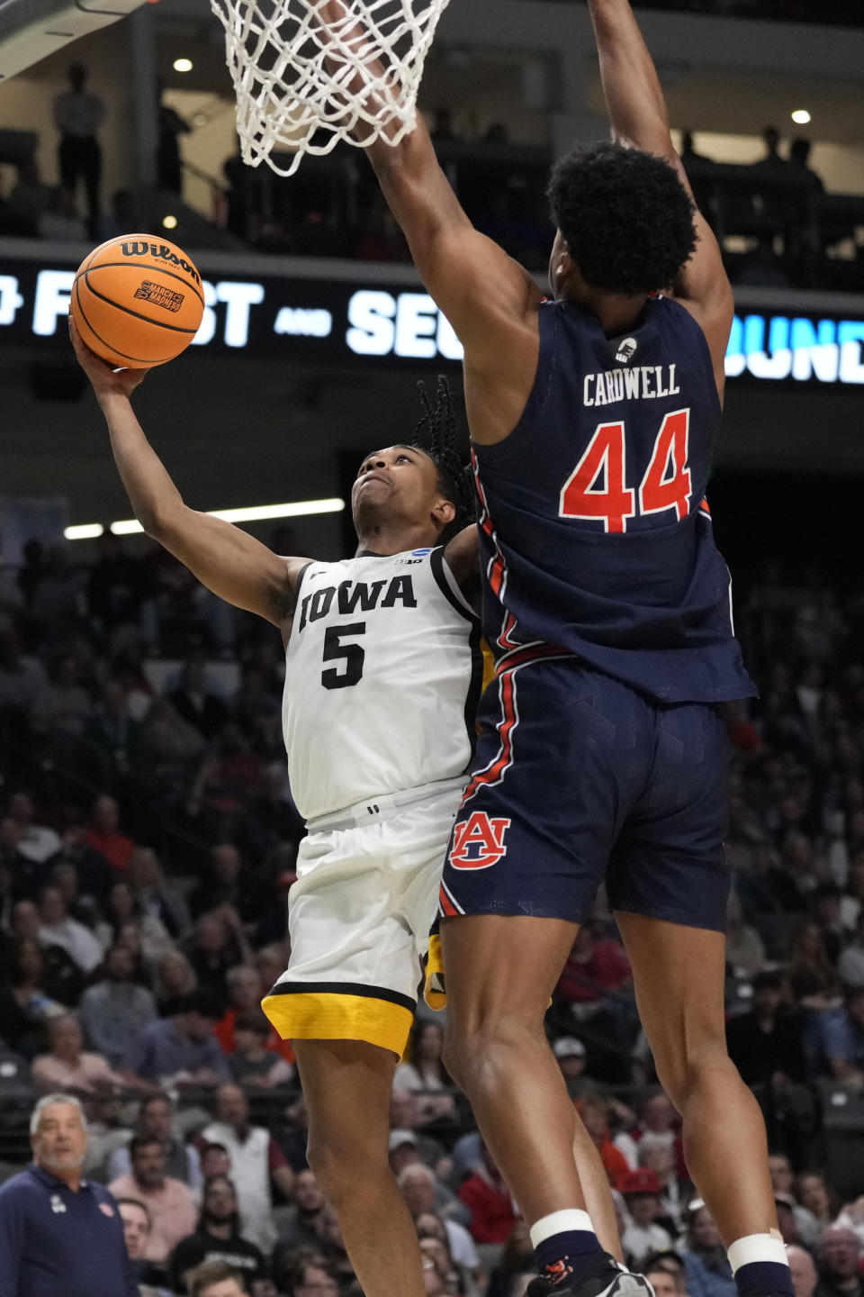 Iowa guard Dasonte Bowen (5) shoots past Auburn center Dylan Cardwell (44) during the first half of afirst-round college basketball game in the men's NCAA Tournament in Birmingham, Ala., Thursday, March 16, 2023. (AP Photo/Rogelio V. Solis)