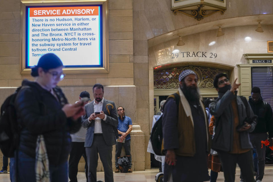A service advisory informs commuters of train line disruptions due to heavy rain at Grand Central Terminal, Friday, Sept. 29, 2023, in New York. (AP Photo/Mary Altaffer)