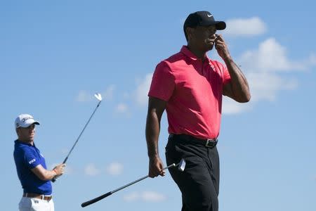 December 3, 2017; New Providence, The Bahamas; Tiger Woods (right) walks after Justin Thomas (left) hit his tee shot on the second hole during the final round of the Hero World Challenge golf tournament at Albany. Kyle Terada-USA TODAY Sports