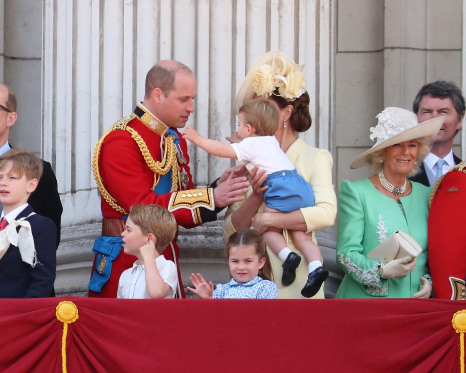 Prince Louis wouldn't stop reaching for his dad.