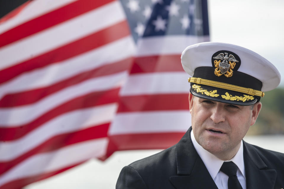 Commander of the USS Kearsarge, Captain Thomas F. Foster speaks during a press conference in front of a Wasp-class amphibious assault ship USS Kearsarge, during the ship's welcome ceremony at the seaport of Klaipėda, Lithuania, Monday, Aug. 22, 2022. The Wasp-class amphibious assault ship USS Kearsarge (LHD 3), flagship of the Kearsarge Amphibious Ready Group and 22nd Marine Expeditionary Unit, arrived in Klaipėda, Lithuania for a scheduled port visit, Aug. 20, 2022. The ship's presence in Lithuania builds on the strong and enduring relationship the United States shares with the Baltic country, showing NATO solidarity and unity. (AP Photo/Mindaugas Kulbis)