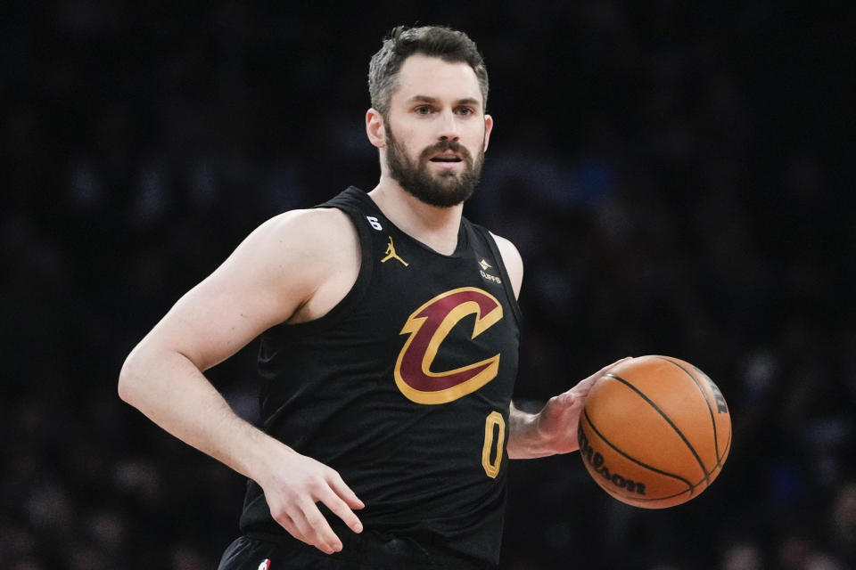 FILE - Cleveland Cavaliers' Kevin Love (0) controls the ball during the first half of an NBA basketball game against the New York Knicks, Jan. 24, 2023, in New York. Love, a five-time All-Star and 15-year NBA veteran, cleared waivers Monday, Feb. 20, 2023, then signed a contract to join the Miami Heat for the remainder of the season not long afterward. (AP Photo/Frank Franklin II, File)